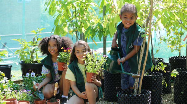 Children taking part in gardening activities as part of Zoo It Yourself at ZSL London Zoo