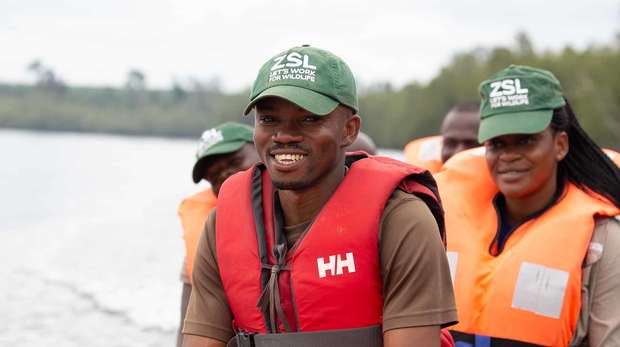 ZSL conservationists on a boat wearing life jackets