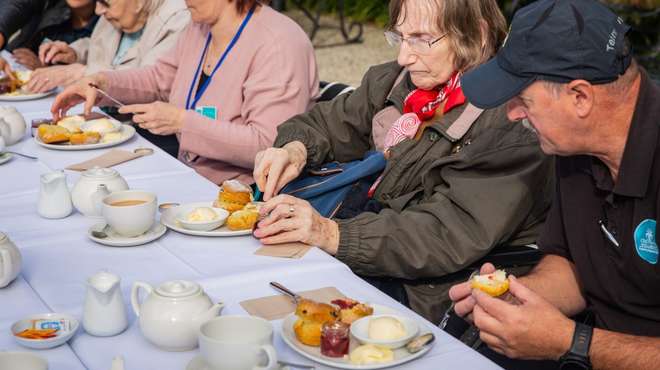 A group of care residents enjoy the new Tour and Tea experience at ZSL London Zoo