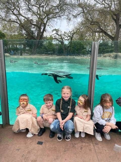 Children by the penguin pool at London Zoo