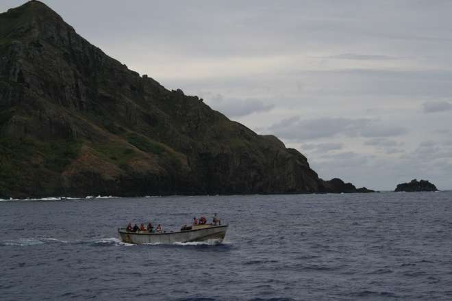 The Pitcairn longboat approaches the Claymore II