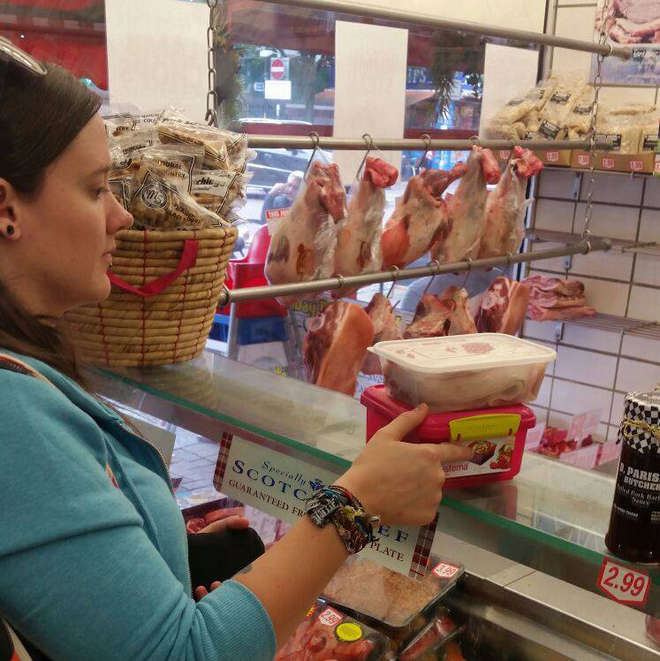 Colette taking her own reusable boxes to the butchers to avoid plastic packaging