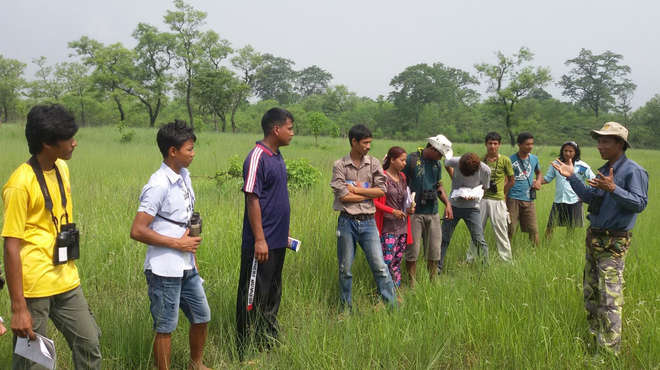 DB in a field with several local youths