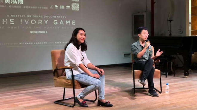 Hongxiang Huang from 'The Ivory Game' on stage answering questions