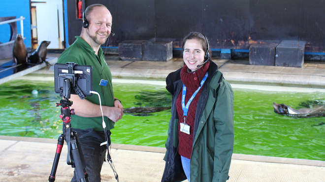 Photograph of the Tim and Charlotte presenting from within the sealion encl
