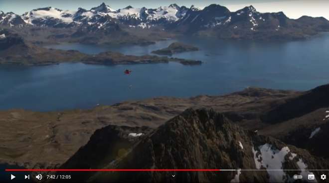 A screen shot showing film footage of the mountains of South Georgia
