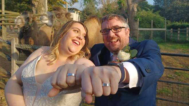 Matt Robbins and Alison Russell show off their wedding rings at ZSL London Zoo