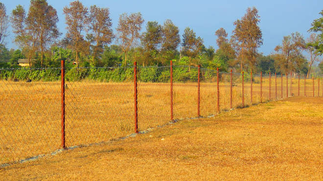 Wire fencing on desert surface